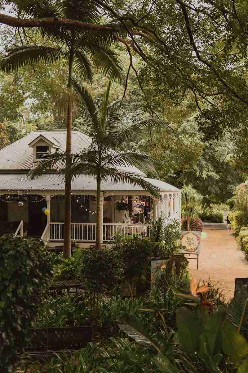 Thousands of lives A cozy house sits amidst lush greenery.