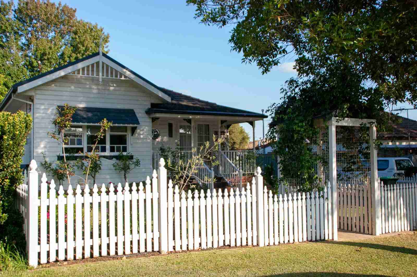It's all about the energy A white picket fence in front of a house